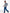 A man wearing a gray quarter-zip sweater with blue and green striped accents on the sleeves, paired with blue jeans and dark sneakers, walking against a white studio background. - Zinc