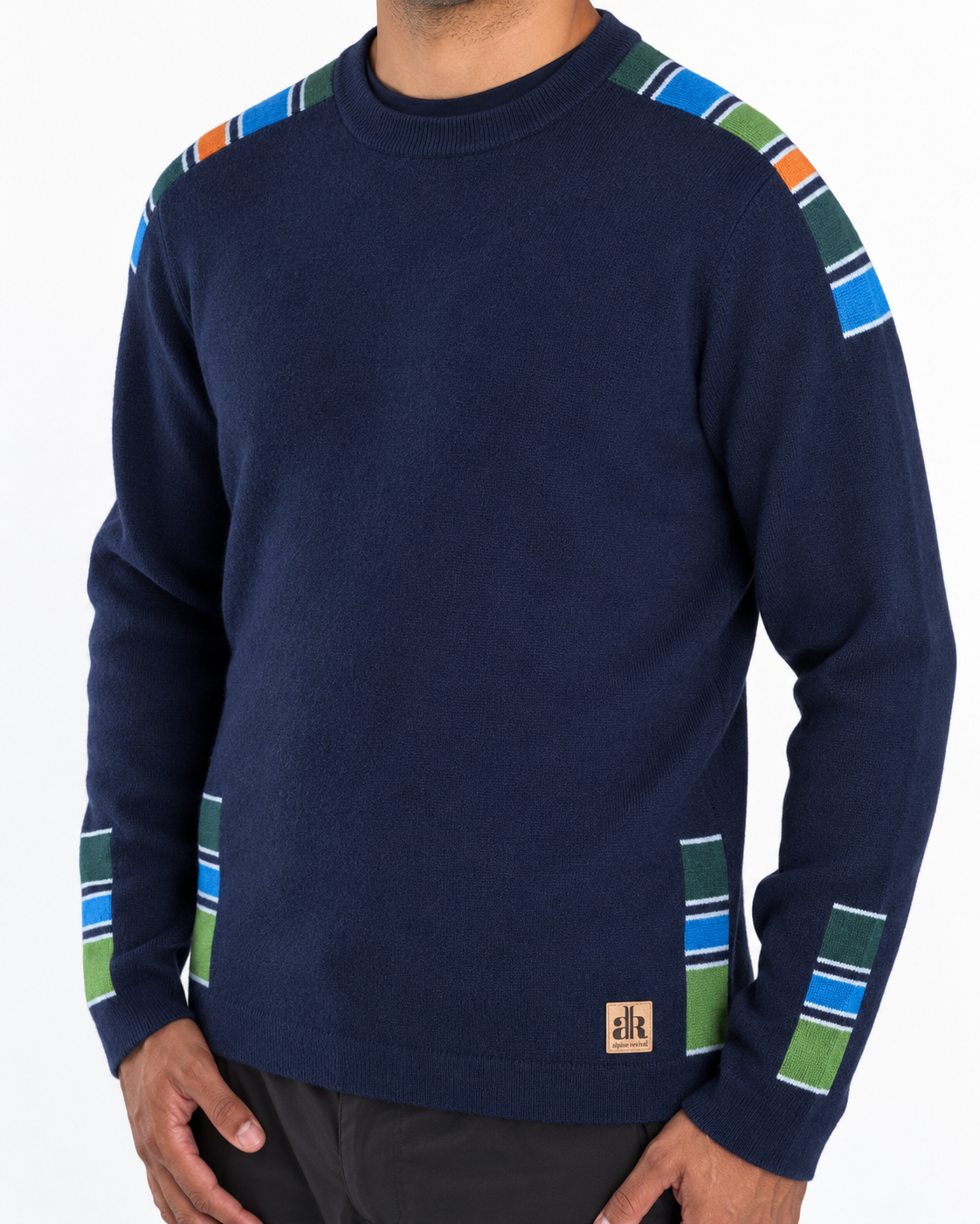 A navy blue crewneck sweater with colorful striped shoulder and sleeve accents in green, blue, orange, and white, shown on a model against a white background. - Navy