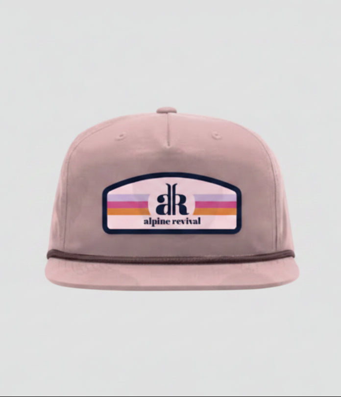 Pink cap with a logo on a white background