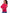 A woman wearing a bright pink crewneck sweater with colorful striped details on the sleeves, paired with blue jeans, photographed against a plain white background. - Watermelon