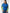 Woman wearing a blue sweater with green striped sleeves on a white background