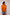 Woman wearing an orange sweater with colorful stripes on a plain background